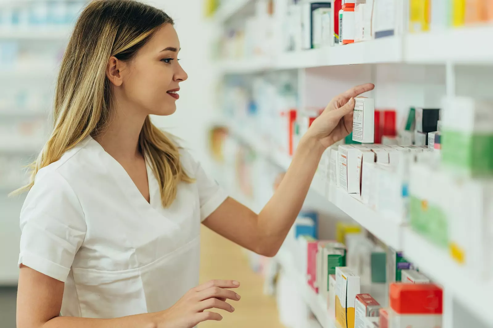 pharmacist searching for prescription