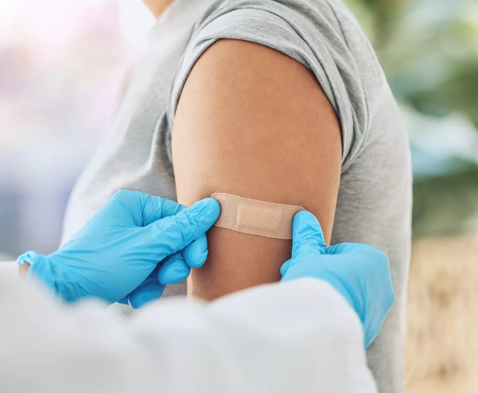 pharmacist giving a vaccine